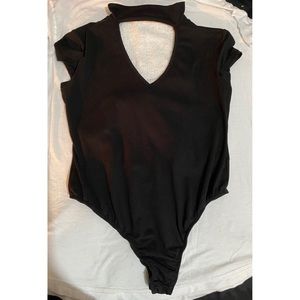 Bodysuit with open chest; neck attachment.